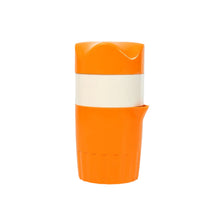 Orange juicer with angled spout
